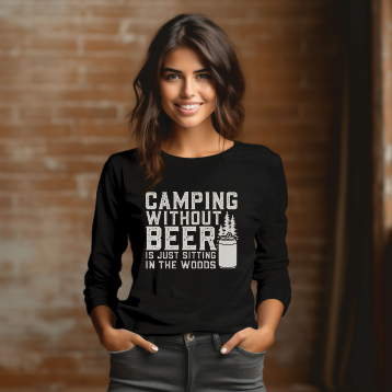 Smiling young woman in black long sleeve tee with white graphic: “Camping without beer is just sitting in the woods”.