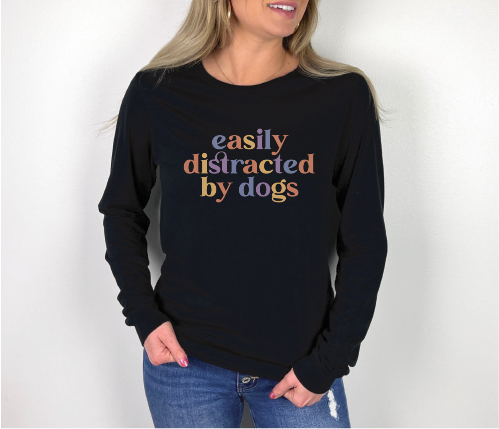 “Easily Distracted By Dogs” graphic on black long sleeve tee shirt.