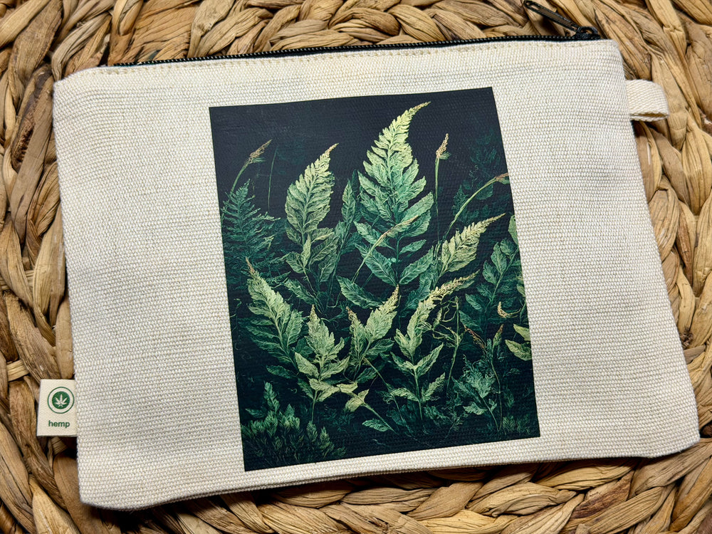 Zippered pouch with graphic of ferns printed on it.