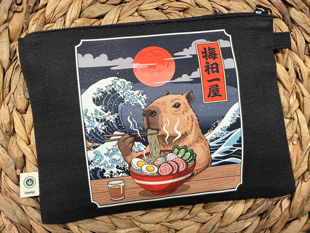 Illustration of an capybara eating a bowl of ramen.