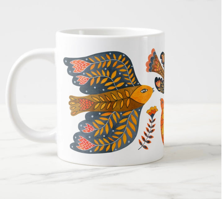 Large white mug with colorful water colored bird and flower elements.