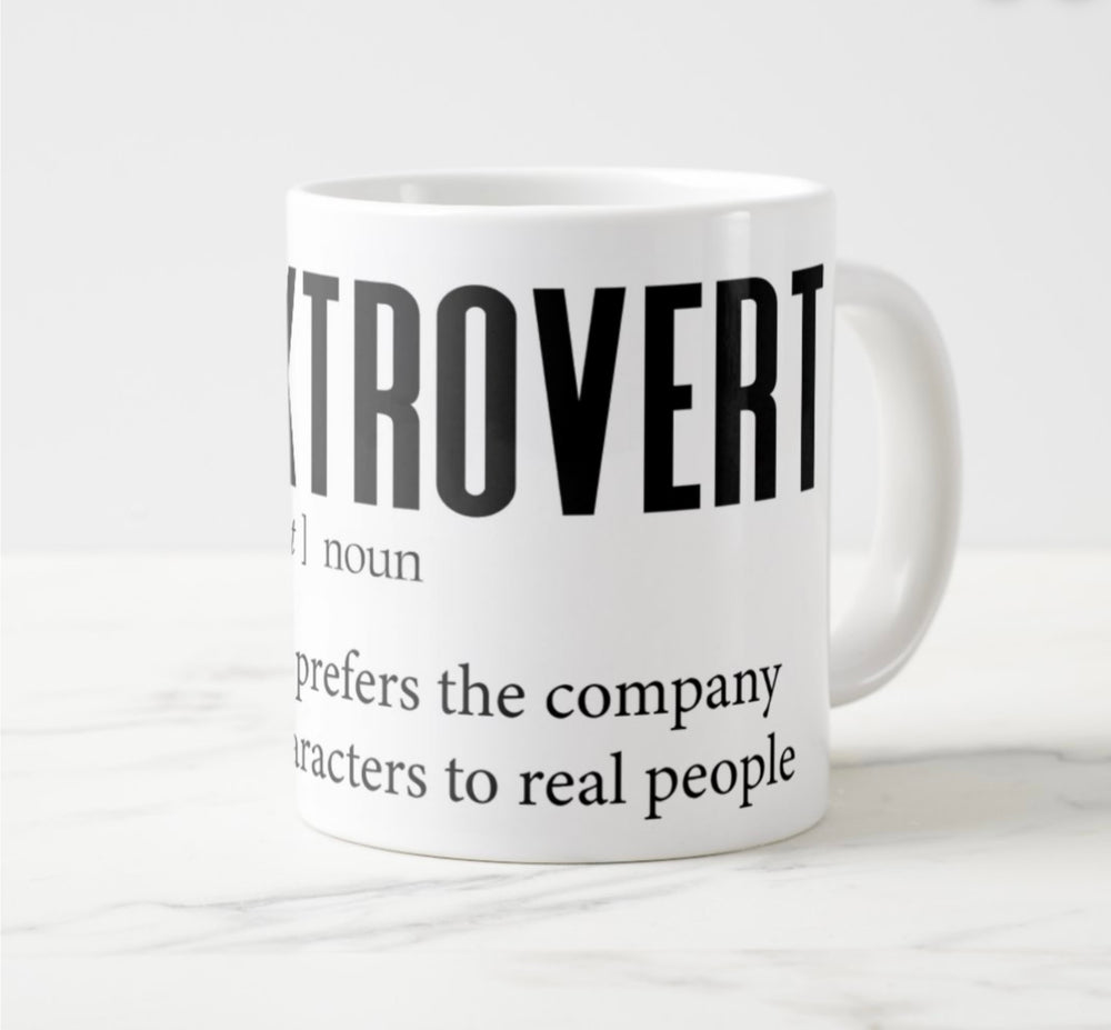 Large white mug with graphic: “Booktrovert: Book-tro-vert, noun. A person who prefers the company of fictional characters to real people.”