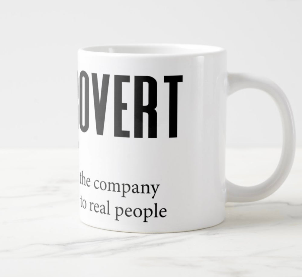 Large white mug with graphic: “Booktrovert: Book-tro-vert, noun. A person who prefers the company of fictional characters to real people.”