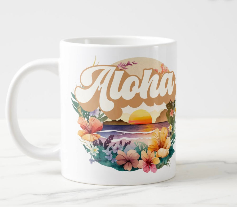 Large white mug with colorful sunset and flowers graphic with word “Aloha”.