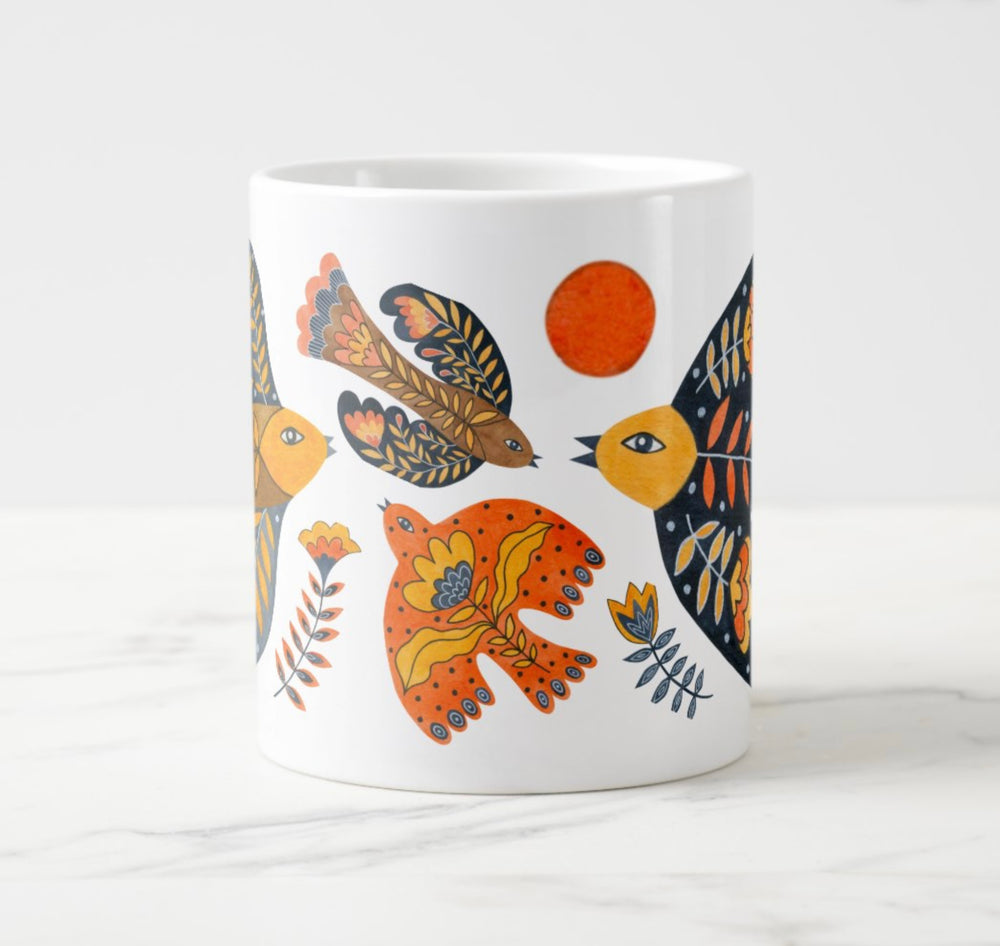 Large white mug with colorful water colored bird and flower elements.