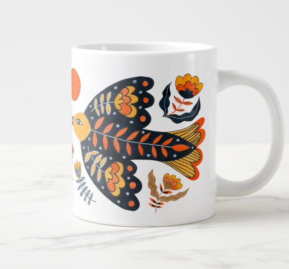 Large white mug with colorful water colored bird and flower elements.