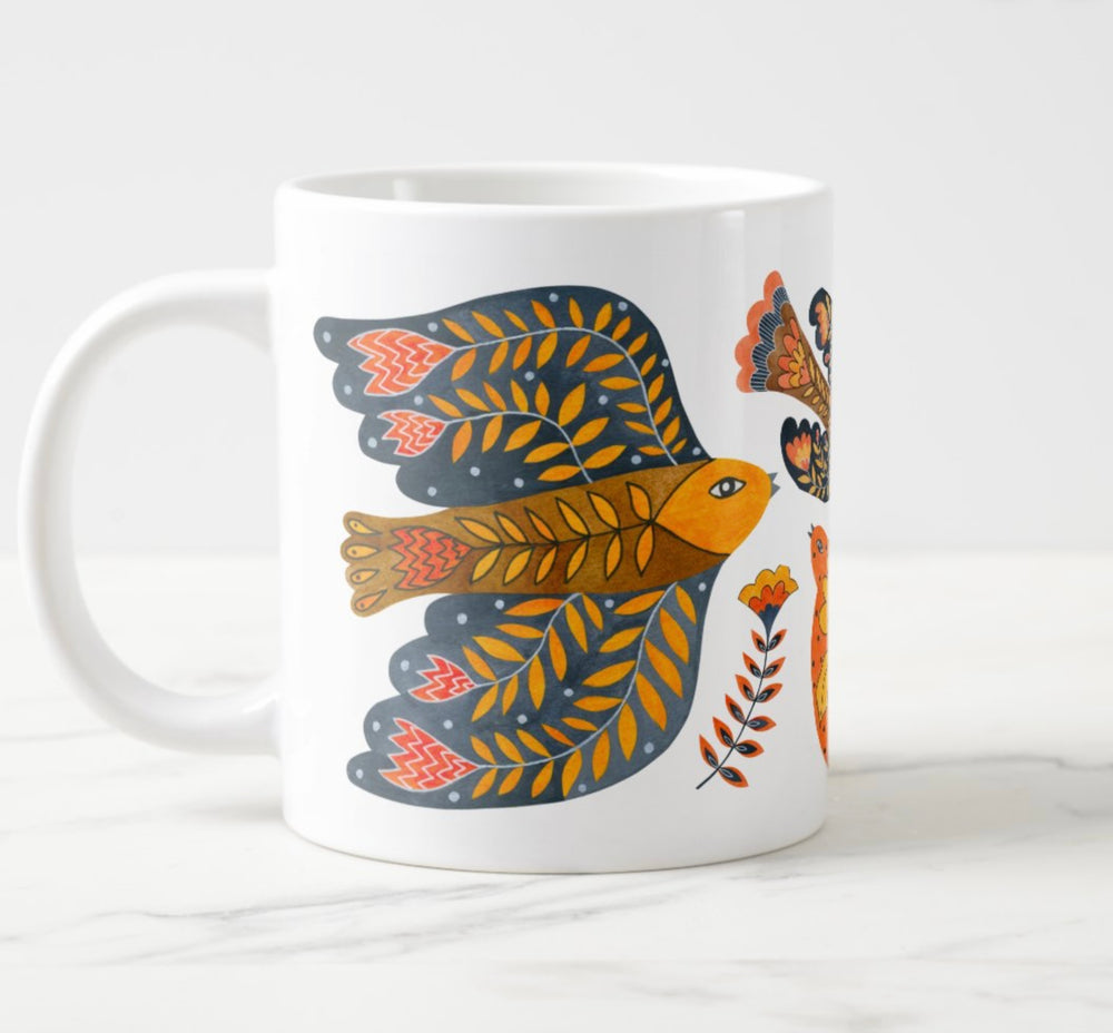 Large white mug with colorful water colored bird and flower elements.