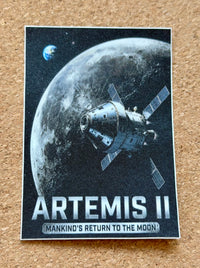 Artemis II spacecraft next to moon, with Earthrise in the distance.