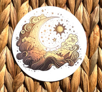 Round sticker with golden-toned surf waves and moon and sun