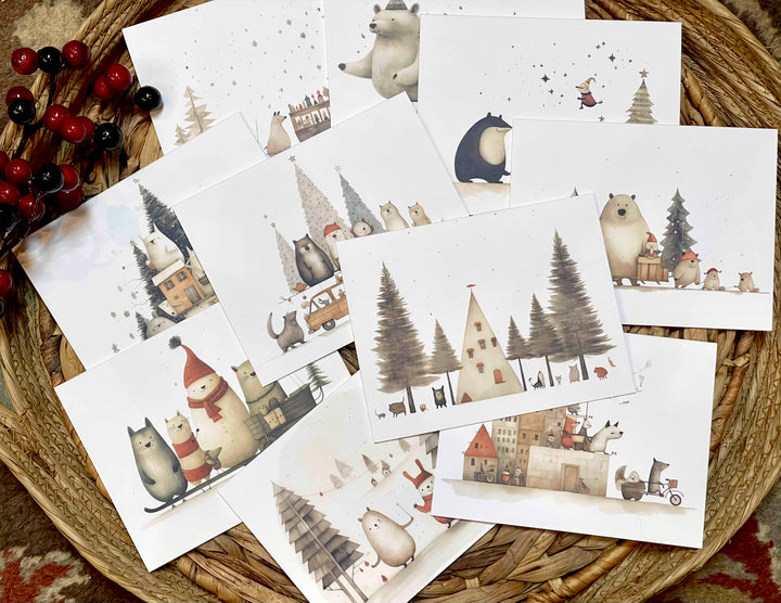 Set of Christmas-themed cards with illustrations of animals and a village scene on a woven surface.