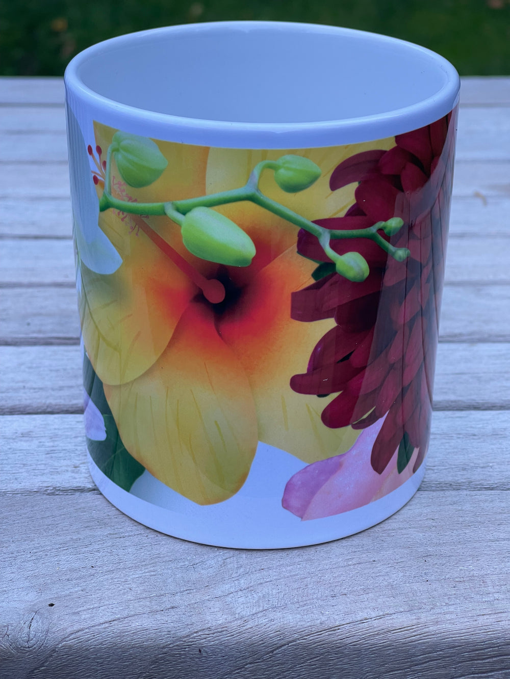 Mug with floral design attached to a wooden surface