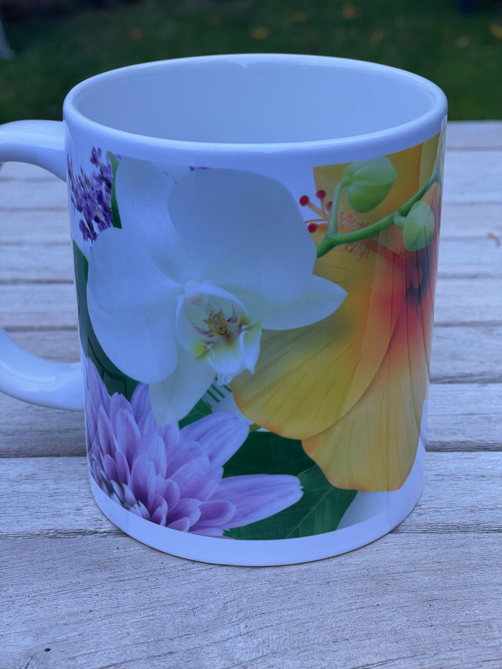 Mug with floral design on a wooden surface