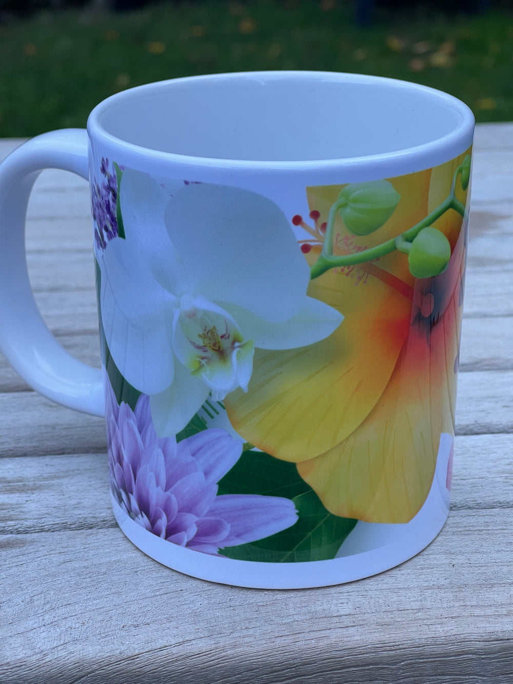 Mug with floral design on a wooden surface