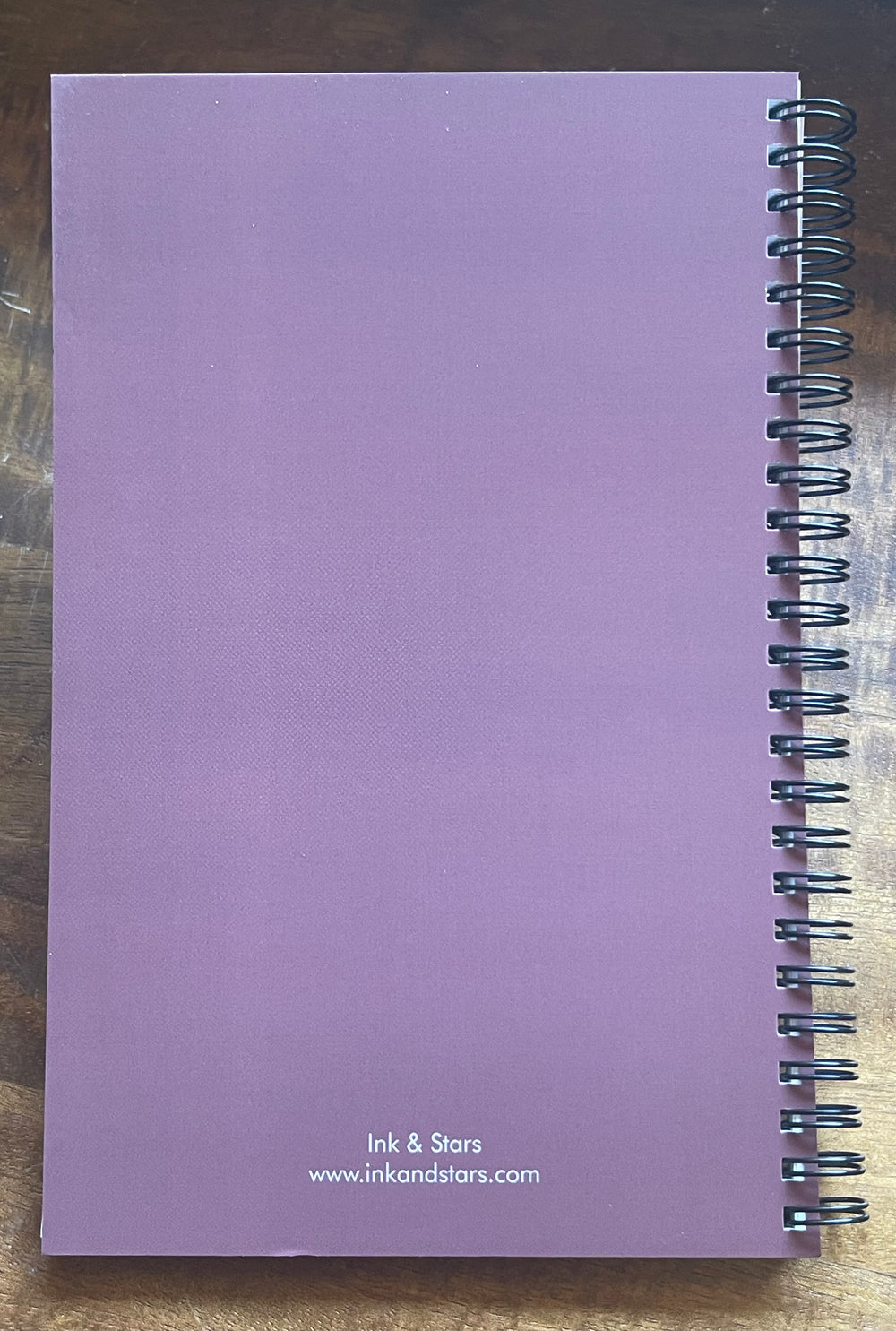 Back cover of notebook (purple) with Ink & Stars name and URL.