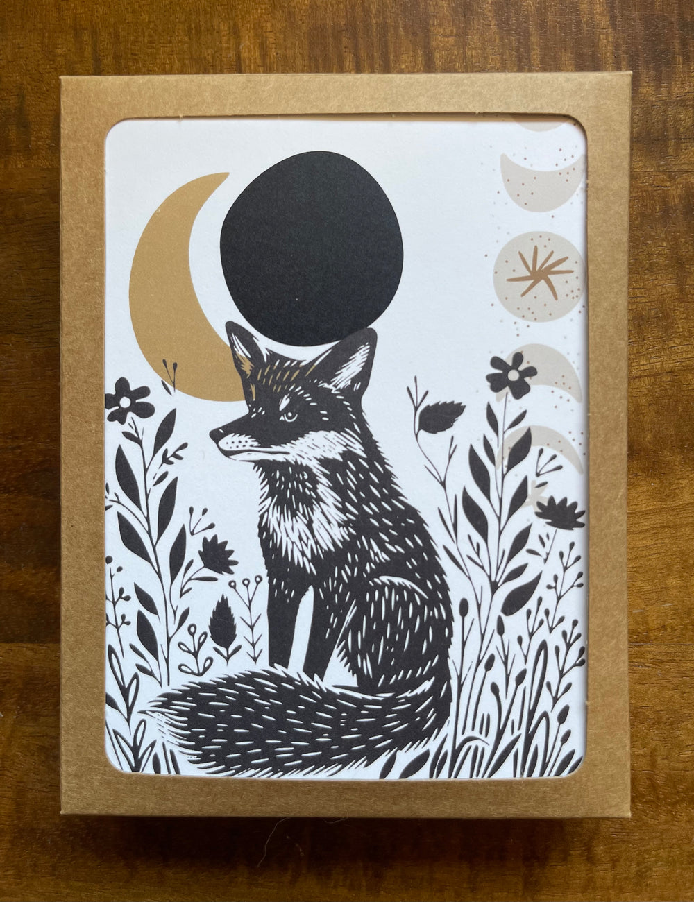 Box of greeting cards featuring a fox and crescent moon graphic.