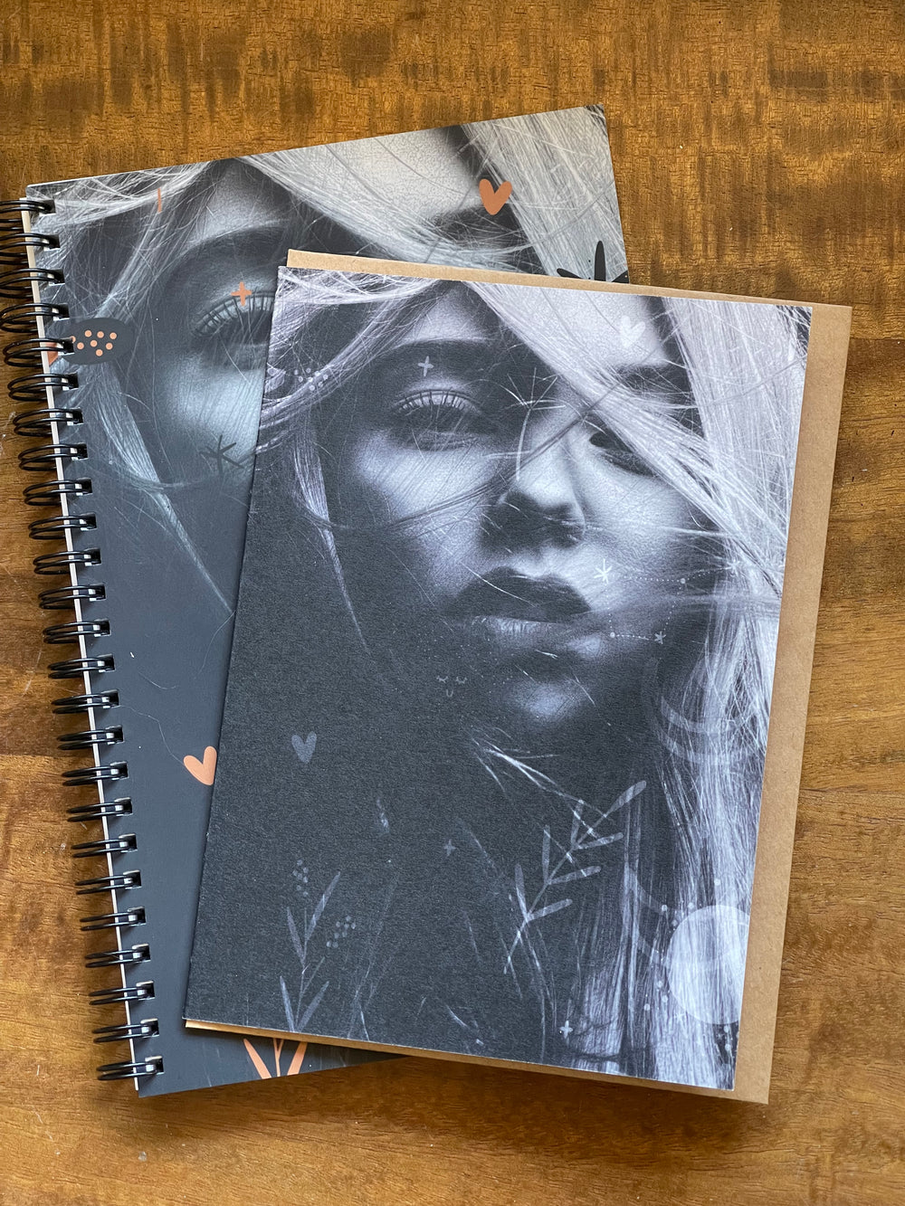 Greeting card and matching spiral-bound notebook, featuring black and white image of young bohemian woman.
