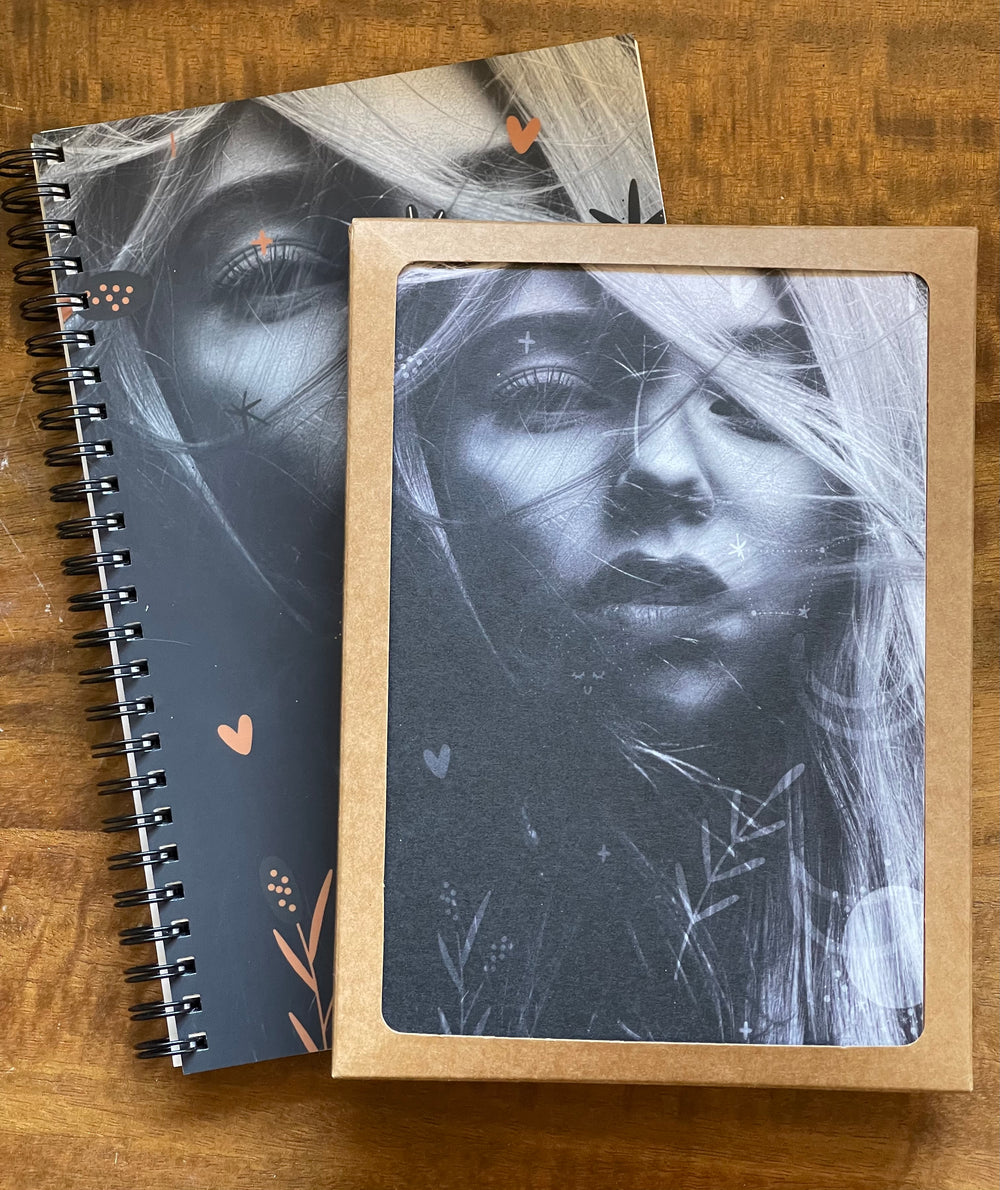 Greeting card and matching spiral-bound notebook, featuring black and white image of young bohemian woman.