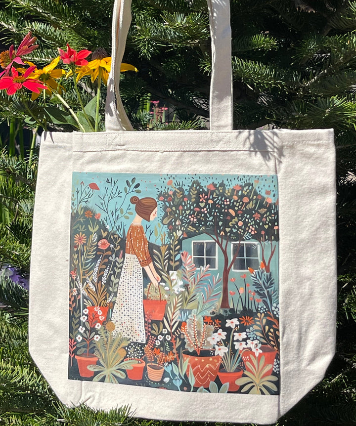 Tote bag with folk art style  illustration of a woman tending to her plants in her yard.