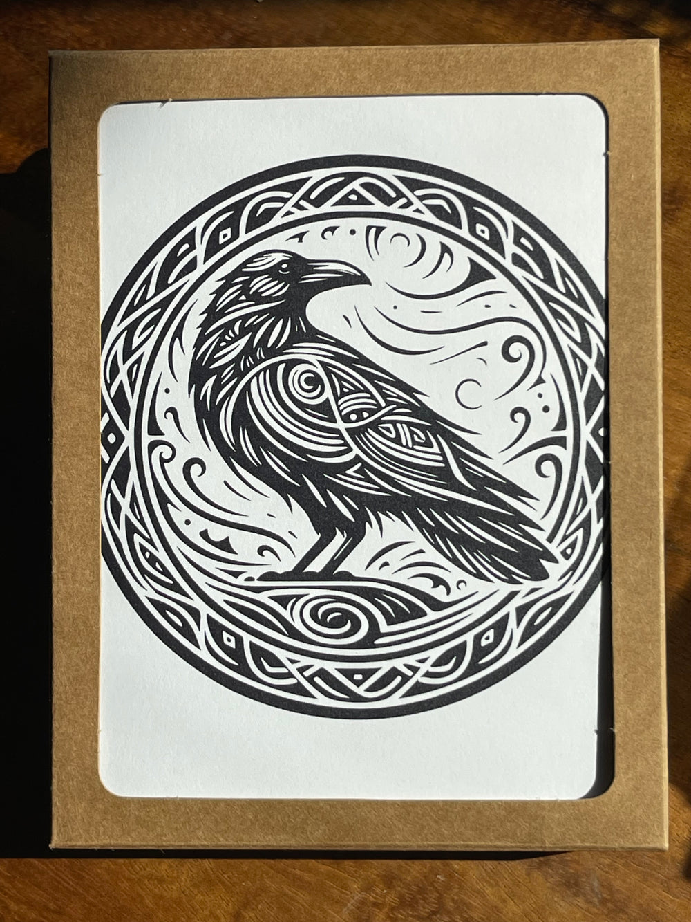 Boxed greeting cards featuring an illustrated raven.