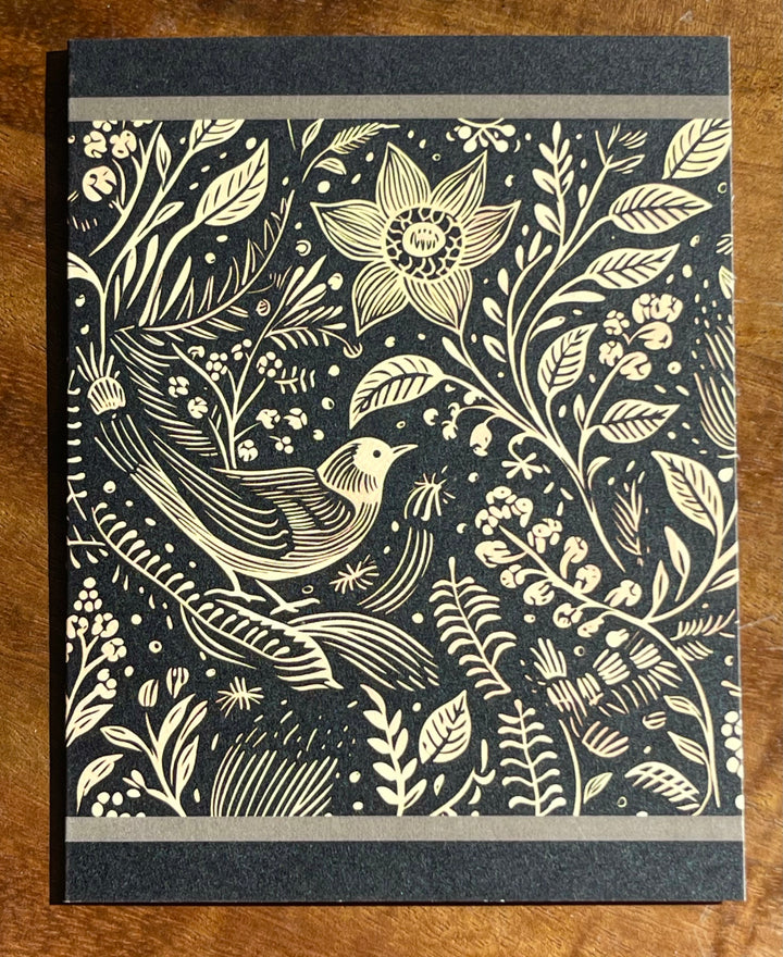 Greeting card with black and beige illustration of a bird and flowers.