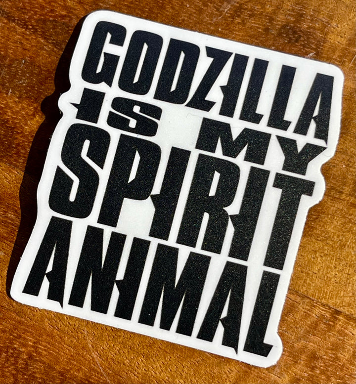 Black and white sticker saying “Godzilla Is My Spirit Animal”.