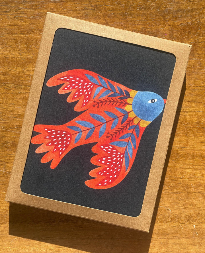 card with red folklore bird on dark background
