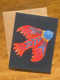 card with red folklore bird on dark background