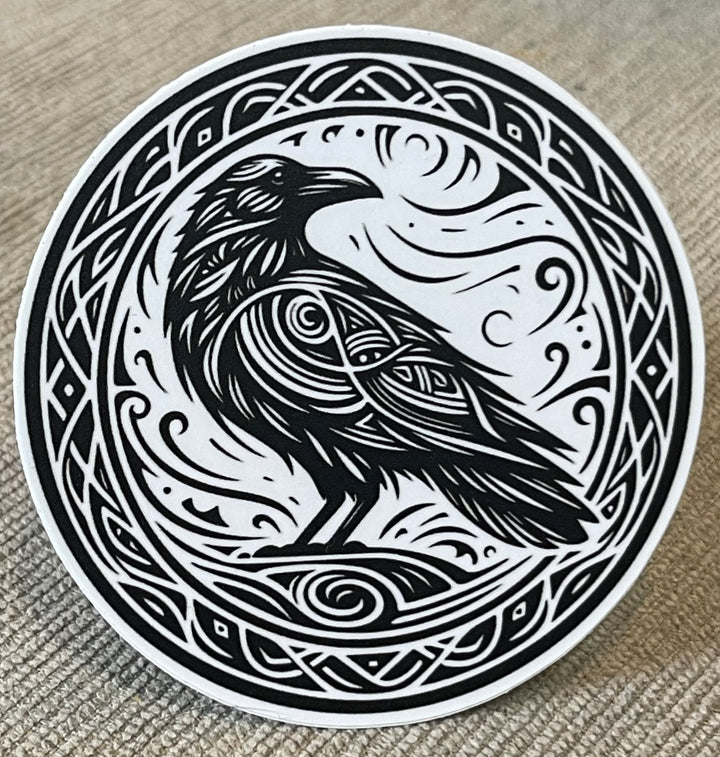 Black and white sticker featuring an illustrated raven.