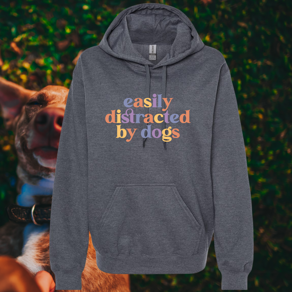 “Easily Distracted By Dogs” graphic on dark grey hooded sweatshirt.